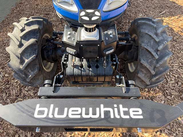 The Bluewhite retrofit kit includes LiDAR (the white-and-black cylinder toward the top of the photo) and optical cameras to help a tractor make its way through a field safely. There's also, as a very last resort, a physical bumper that acts as a kill switch if it bumps against anything. (DTN/Progressive Farmer photo by Joel Reichenberger)
