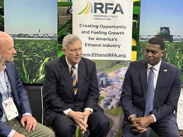 Agriculture Secretary Tom Vilsack, center, talks with Geoff Cooper, president and CEO of the Renewable Fuels Association, left, and EPA Administrator Michael Regan on Friday at the Commodity Classic expo in Houston. Cooper and others sat down with administration officials to talk about the guidance delay for Sustainable Aviation Fuel tax credits. (DTN photo by Chris Clayton)