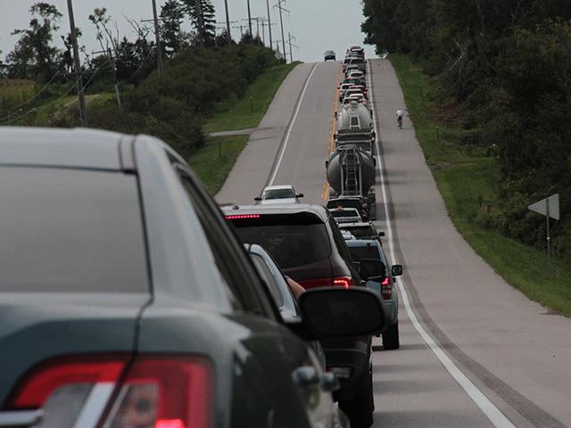 As some rural counties expect to see tens of thousands more visitors than usual next week, they are warning residents of clogged roads and possible trespassers on rural property. This was one of the rural roads in southeast Nebraska in 2017 when traffic slowed to a stop as frustrated people tried to get out of cities to see a total solar eclipse. (DTN photo by Elaine Shein)