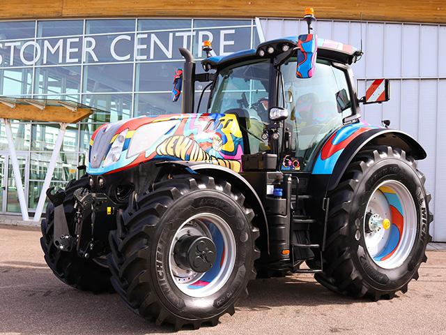 New Holland's one-off special edition T7.300 tractor was created in recognition of 60 years of production at its Basildon, England, factory. CNH Centro Stile did the paint, the colors and patterns a tribute to "Swinging '60s" London, with psychedelic shapes and colors of blue, yellow, maroon and pink around New Holland's distinctive leaf logo in bright yellow on the hood. (Photo courtesy of New Holland)