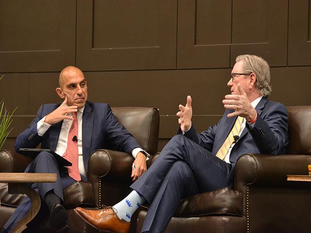 Rostin Behnam, left, chairman of the Commodity Futures Trading Commission (CFTC), listens to Jeffrey Schmid, chairman of the Kansas City Federal Reserve Bank, talk about the agricultural economy and the Fed's task to lower inflation to 2%. Schmid explained the reluctance of Fed bankers right now to lower interest rates. (DTN photo by Chris Clayton)