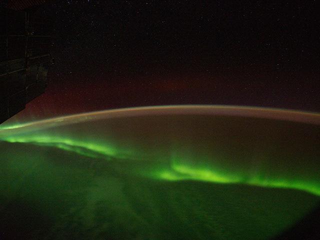 This is a nighttime image of the Aurora Australis and parts of the southeastern Indian Ocean as seen from the International Space Station. Geomagnetic storms, the aurora being one result, can impact earthbound positioning signals, as Deere explains. (Photo courtesy of NASA)