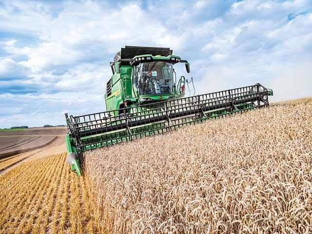 Deere's T6 800 walker combine includes many features from the X9 and S7 Series combines with precision ag technology, larger cab and increased unloading rate. (Photo courtesy of John Deere)