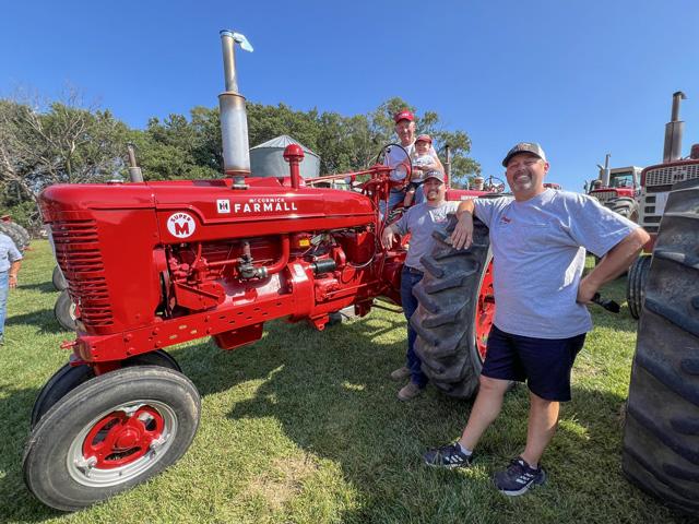 Four generations of the Dreessen family enjoy collecting International tractors. The Kennard, Nebraska, farm family recently displayed all 51 tractors for family and friends for Wayne Dreessen's 80th birthday. (DTN photo by Russ Quinn)