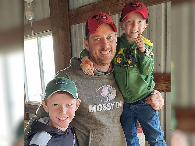 Chariton County, Missouri, farmer Charles Henke is considering what his farm's future may be as a power transmission project that is slated to begin construction next year. Pictured are Henke's son Byron, left, and Bennett, right. (Photo courtesy Charles Henke)