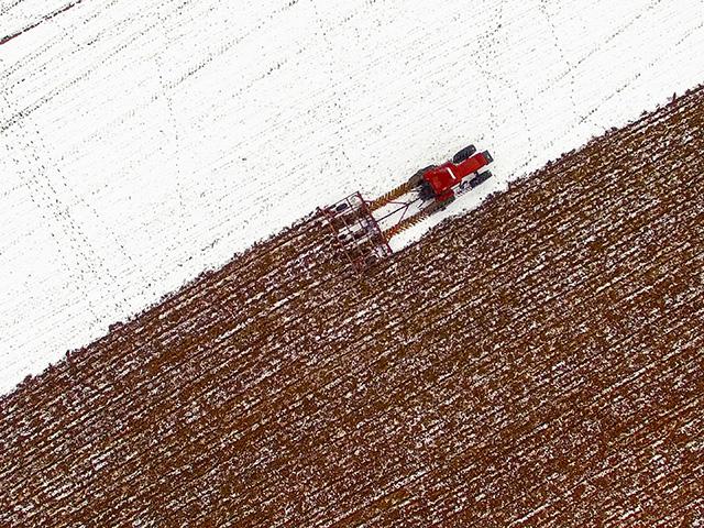 Winter brings unique challenges for farmers -- from icy ground and frozen mud to rain-soaked fields in the South. Keeping farm equipment running smoothly despite these conditions is no small task, but proper tire care can make all the difference. (Photo courtesy of Firestone Ag)