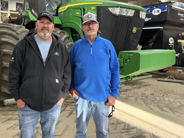 Kenny Rathjen, left, and Monte Simerly earned top honors in the 2024 National Sorghum Yield Contest. Their entry from K&M Farms in Dalhart, Texas, was named the contest's Bin Buster winner with the overall top yield of 240.01 bushels per acre. (Photo courtesy of Kenny Rathjen)