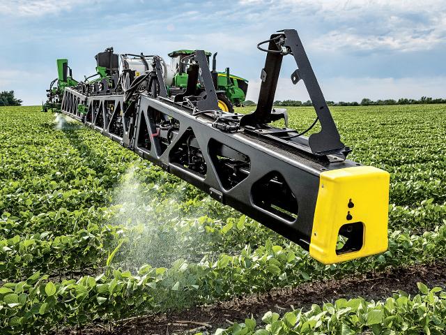 Precision sprayers make thousands of decisions per second as they hunt weeds and soon correct new agronomic deficiencies on the go. (Photo provided by Deere and Company)