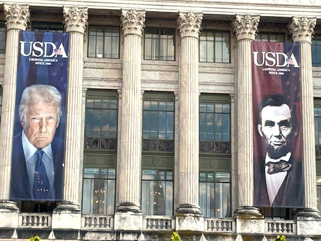 USDA’s headquarters building in Washington, D.C., last year with banners of President Donald Trump and former President Abraham Lincoln, who founded the Department of Agriculture. USDA officials pushed back on criticism of Trump administration policies, saying “President Trump is the most pro-farmer president in our lifetime.” (DTN file photo)