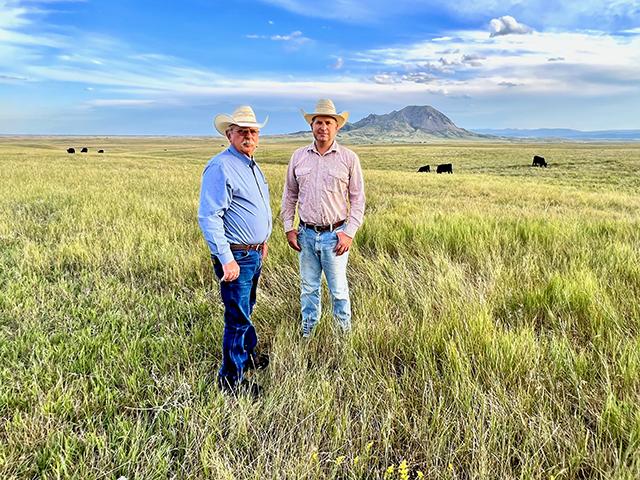 Ed and Britton Blair, and other family members used EQIP funds to help maximize grass production on their South Dakota home ranch, which overlooks Bear Butte in the background. (Progressive Farmer photo by Des Keller)