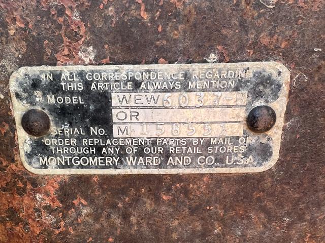 A new purchase on the Quinn farm reveals a Montgomery Ward and Co. running gear on a gravity flow wagon. (DTN photo by Russ Quinn)